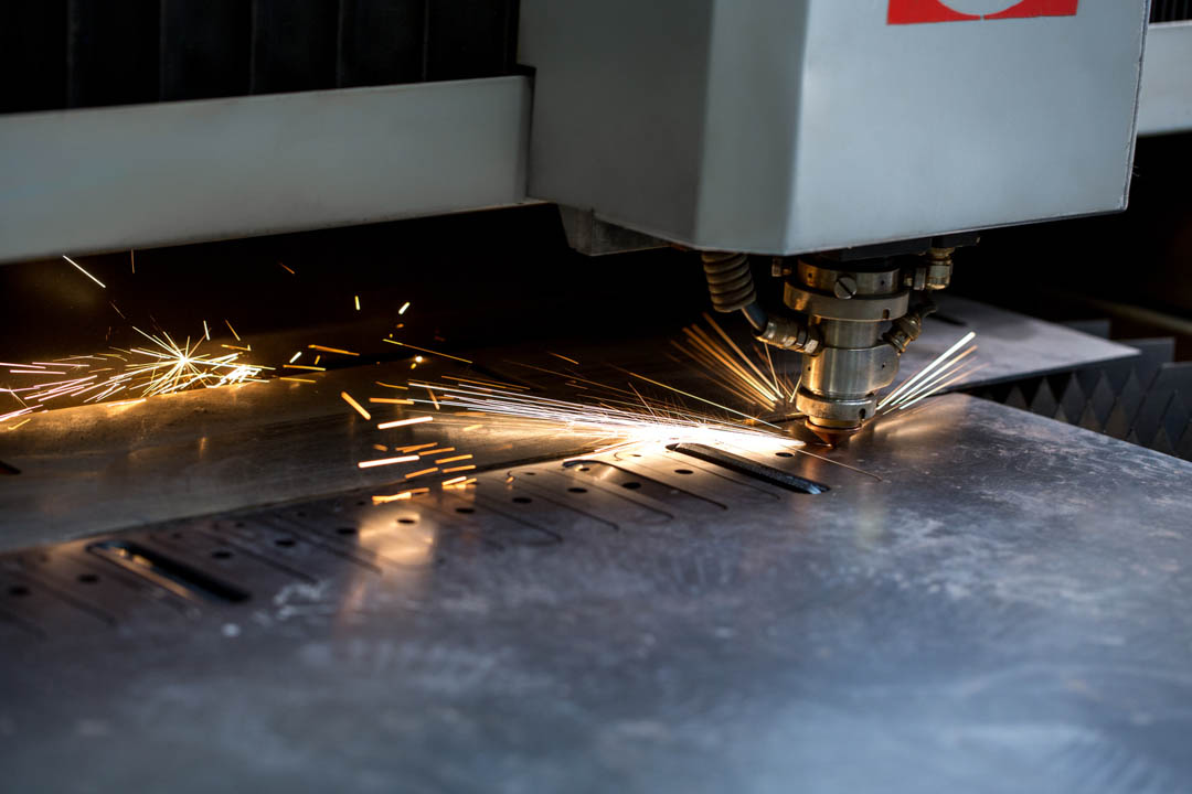 Modern automated machine laser cutting metal sheet